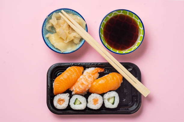 salmon sushi still life - junk food stock pictures, royalty-free photos & images