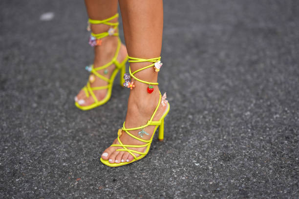Samia Laaboudi wears lime green strappy heels with multi colored charms, outside Jason Wu, during the New York Fashion week Spring/Summer 2025 on...