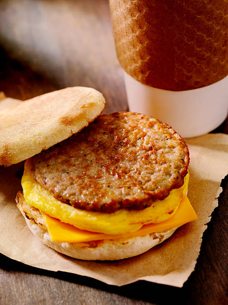 sausage and egg breakfast sandwich - junk food stock pictures, royalty-free photos & images