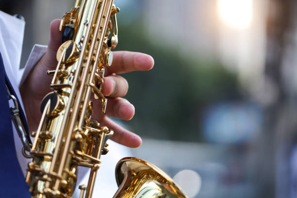 saxophone,international jazz day and world jazz festival. saxophone, music instrument played by saxophonist player musician in fest. - concert stock pictures, royalty-free photos & images