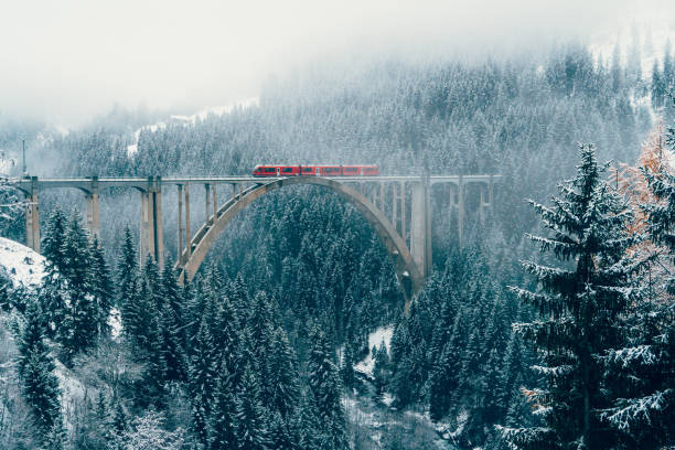 scenic view of train on viaduct in switzerland - travel stock pictures, royalty-free photos & images