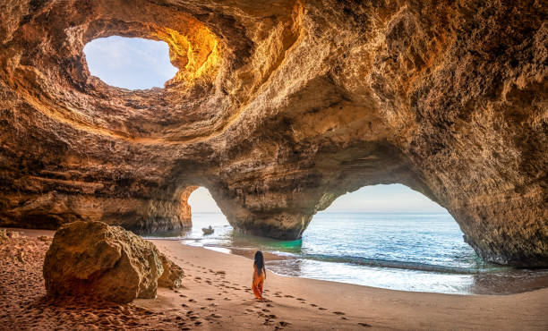 schöne frau in benagil höhle, algarve, portugal - travel stock-fotos und bilder