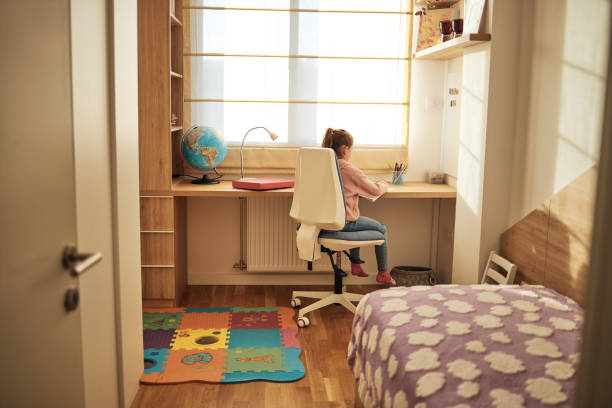 schoolgirl studying at home - home decoration stock pictures, royalty-free photos & images