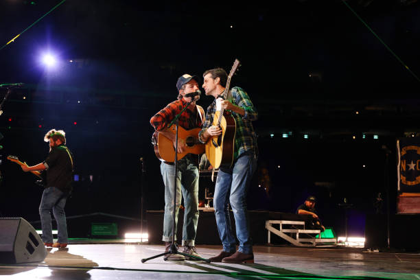 Scott Avett and Seth Avett of The Avett Brothers perform onstage at the Concert For Carolina Benefit Concert at Bank of America Stadium on October...