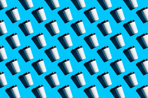 seamless pattern of a disposable cup or takeaway coffee mug, on a blue background. - junk food stock pictures, royalty-free photos & images