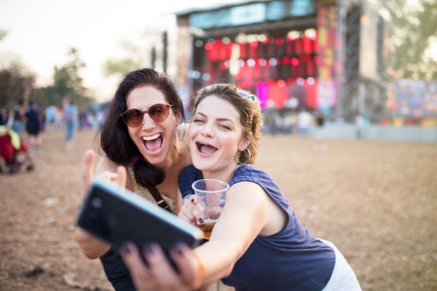 selfie on festival - concert stock pictures, royalty-free photos & images