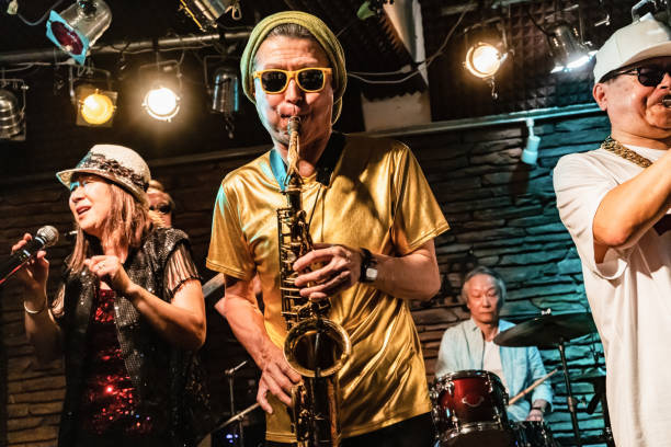 senior band performs hot live stage - concert stock pictures, royalty-free photos & images