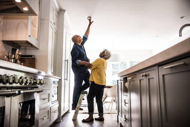 senior couple couple doing diy project at home - home decoration stock pictures, royalty-free photos & images