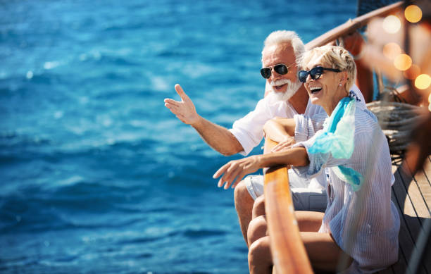 senior couple on a sailing cruise. - travel stock pictures, royalty-free photos & images