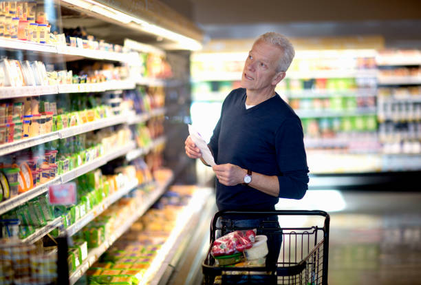 senior man goes grocery shopping. - food stock pictures, royalty-free photos & images