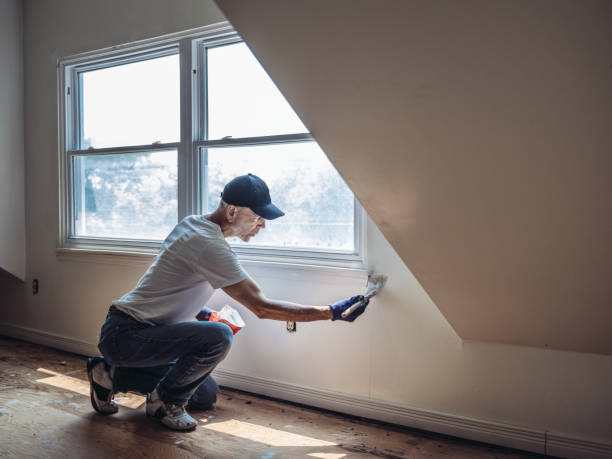 senior man painting apartment interior - home decoration stock pictures, royalty-free photos & images