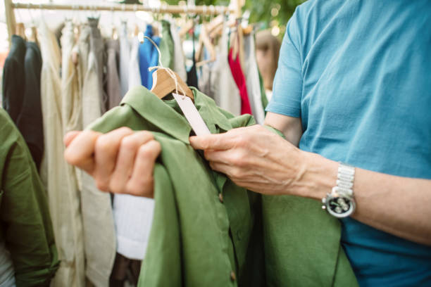 senior man shopping at a local or flea market. sustainable lifestyle and zero waste concept. - fashion stock pictures, royalty-free photos & images
