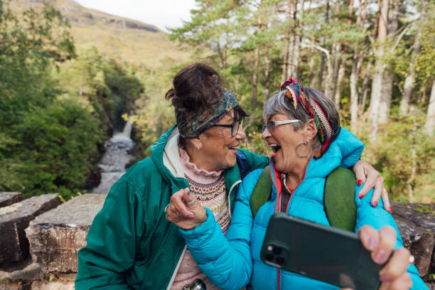 senior women laughing in hiking selfie - travel stock pictures, royalty-free photos & images