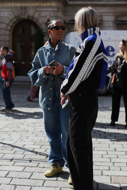 September 13: Honey Sweet Elias is seen wearing a Miu Miu Denim Ensemble and Laura Ingham is seen wearing Navy Track Top. At S.S. Daley during London...