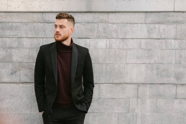 serious, good looking young adult looking away - hairstyle stockfoto's en -beelden