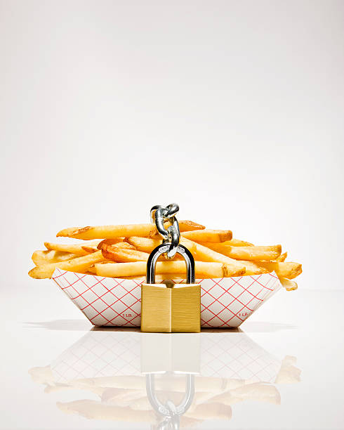 serving of french fries with lock around them - junk food stock pictures, royalty-free photos & images