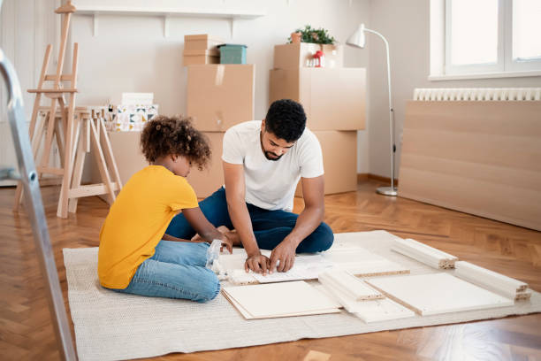 settling into their new home - home decoration stock pictures, royalty-free photos & images