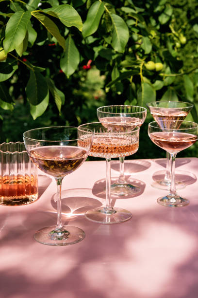 several cocktail or mocktail glasses with rose wine drink - home decoration stock pictures, royalty-free photos & images