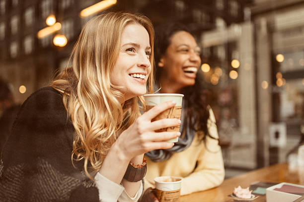 sharing a laugh with my friend - coffee stockfoto's en -beelden