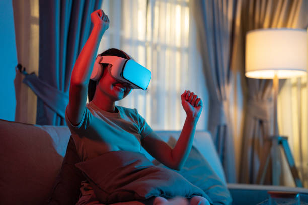 she watched the concert in virtual reality through vr glasses in the living room of her home. - concert stock pictures, royalty-free photos & images