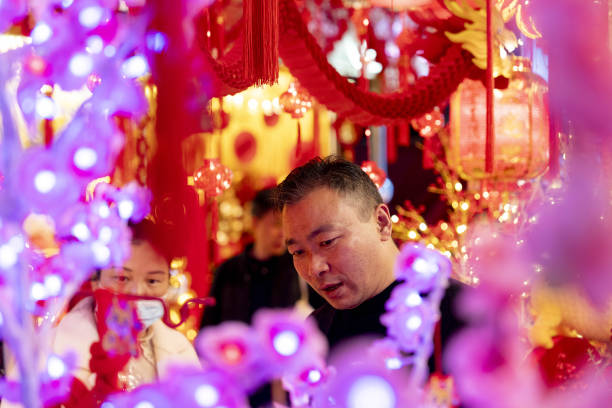 Shoppers browse decorations at Yuyuan Garden in Shanghai, China, on Sunday, Feb. 11, 2024. Just over a year after China ended its Covid-Zero policy,...