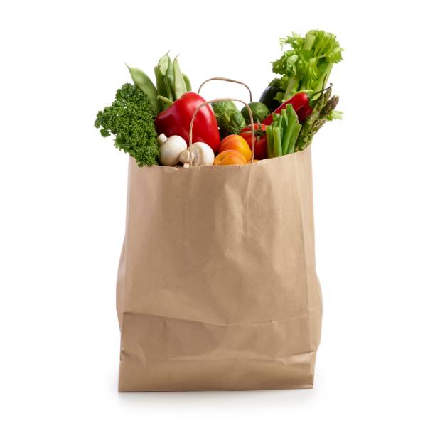 shopping bag full of fresh produce - food stockfoto's en -beelden