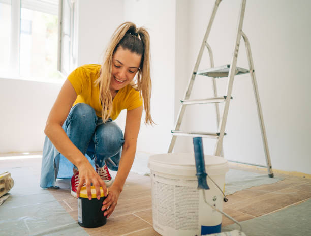 shot of a beautiful young woman painter prepares paint for painting - home decoration stock pictures, royalty-free photos & images