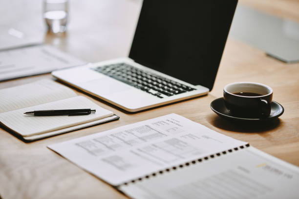 shot of a notebook and laptop in an office - home decoration stock pictures, royalty-free photos & images