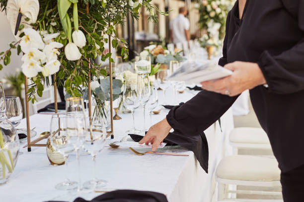 shot of an unrecognisable woman decorating a table in preparation for a wedding reception - home decoration stockfoto's en -beelden