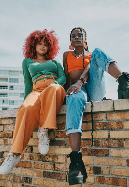 shot of two young female friends spending a day in the city - fashion stock pictures, royalty-free photos & images