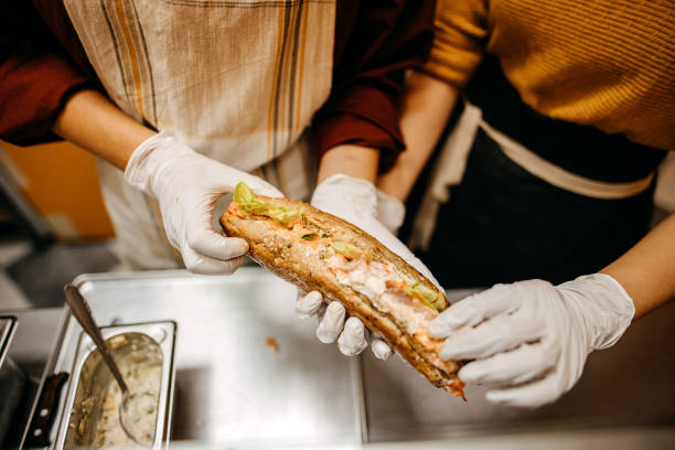 showing a sandwich - junk food stock pictures, royalty-free photos & images