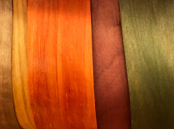 side of a basket made of thin cut of wood material and colored in orange green and brown tones - home decoration stock pictures, royalty-free photos & images