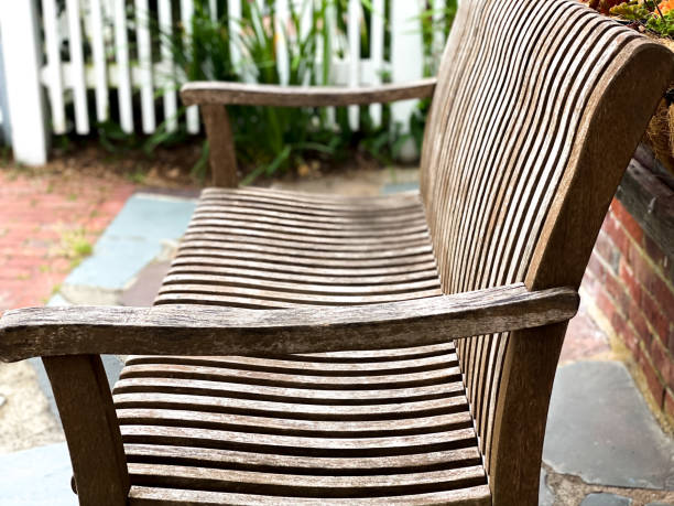 side profile of wooden outdoor bench - garden decoration stock pictures, royalty-free photos & images