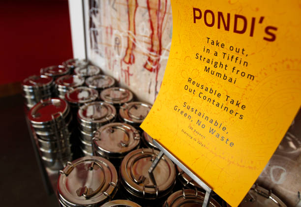 Sign at Pondicheri Indian restaurant telling customers about the Tiffin , reusable take-out containers, Tuesday, June 28 in Houston. Pondicheri is...