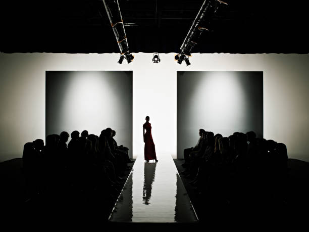 silhouette of female model on catwalk - fashion week stock pictures, royalty-free photos & images