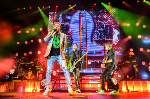 Simon Le Bon, John Taylor and Dominic Brown of Duran Duran perform on stage during the Future Past tour at Utilita Arena Birmingham on May 5, 2023 in...