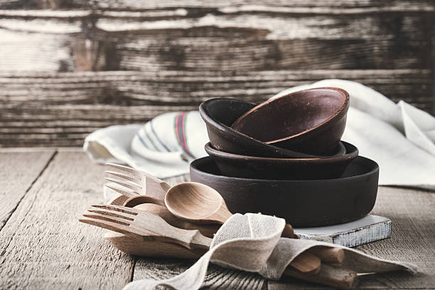 simple crockery and wooden cooking utensils set on rustic table - home decoration stock pictures, royalty-free photos & images