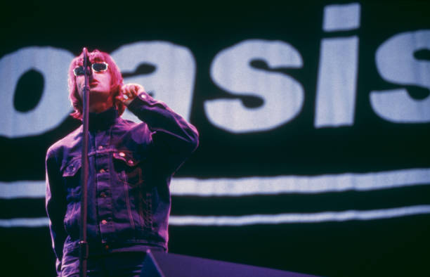 Singer Liam Gallagher performing with British rock band Oasis, UK, August 1996.
