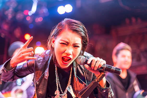singer of the band performing on stage - concert stock pictures, royalty-free photos & images