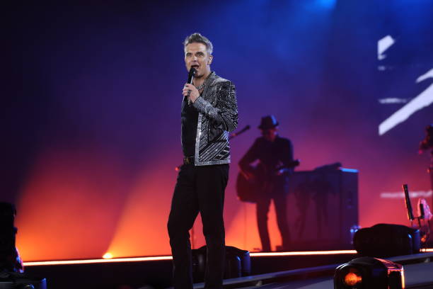 Singer Robbie Williams performs live on stage during his One Show & One Night Only concert at Messe Muenchen on August 27, 2022 in Riem/Munich,...