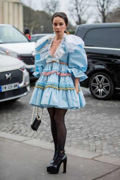 Sira Pevida seen wearing blue dress, hair band, sheer tights, bag Chanel outside Viktor & Rolf during Paris Fashion Week - Haute Couture...