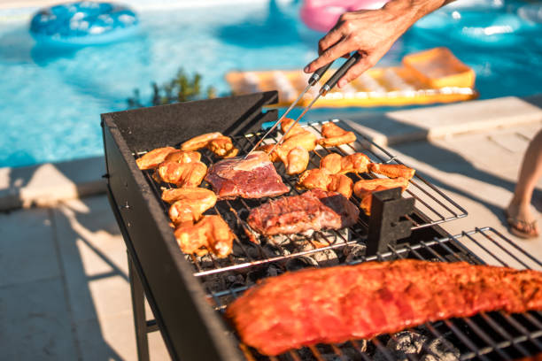 sizzling meat on the grill by hispanic chef - food stock pictures, royalty-free photos & images