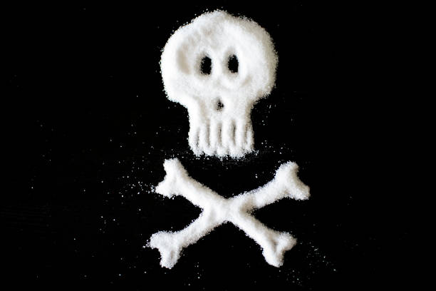 skull and crossbones made of sugar or salt - junk food stock pictures, royalty-free photos & images