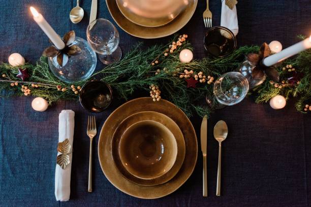 sky view of a modern dinner table setting with candles and greenery - home decoration fotografías e imágenes de stock
