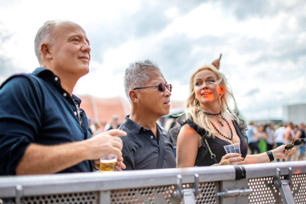 small group of diverse senior friends at a dance event - concert stock pictures, royalty-free photos & images