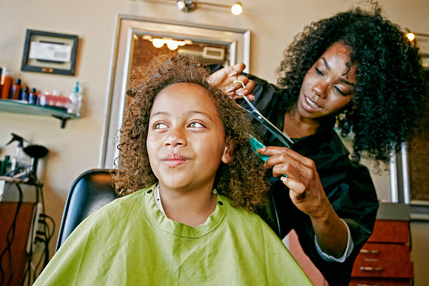 smiling hairdresser and customer in hair salon - hairstyle stockfoto's en -beelden