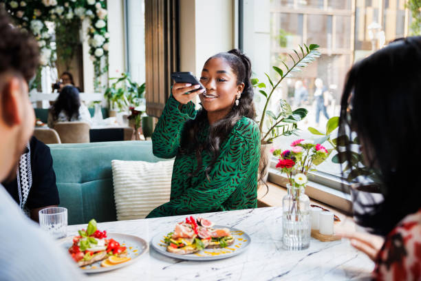 social dining and digital sharing - food stock pictures, royalty-free photos & images