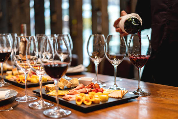 sommelier serving glasses of winetasting event - food stock pictures, royalty-free photos & images