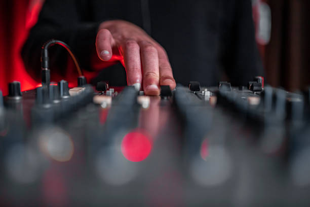sound mixer and dj's hand - concert stock pictures, royalty-free photos & images