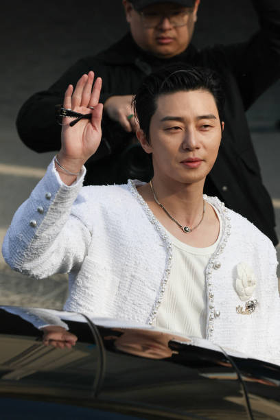 South Korean actor and singer Park Seo-joon waves as he arrives to attend the presentation by Chanel for the Womenswear Ready-to-wear Fall-Winter...